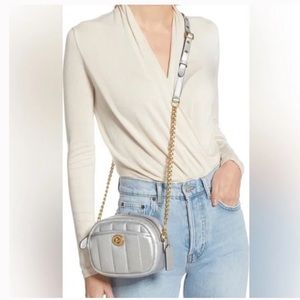 Coach metallic silver quilted crossbody bag.
